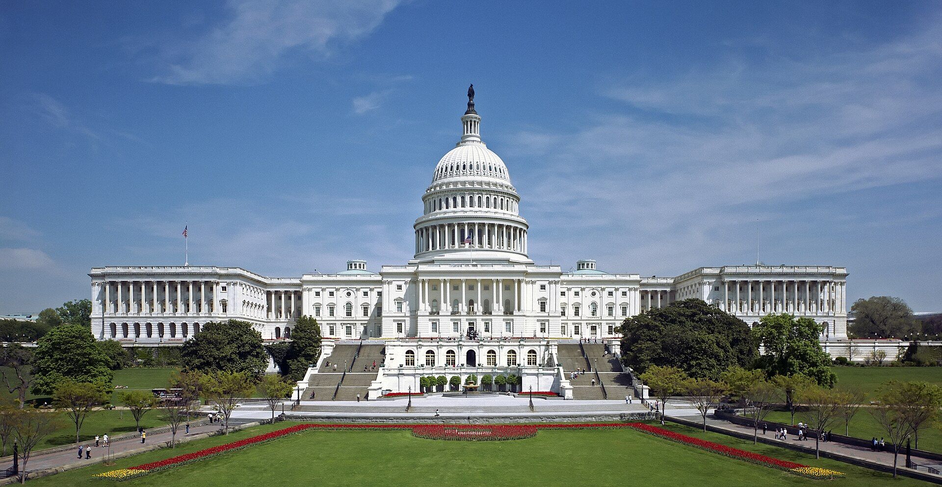 The west front of the US Capitol building in Washington, DC, under a blue sky