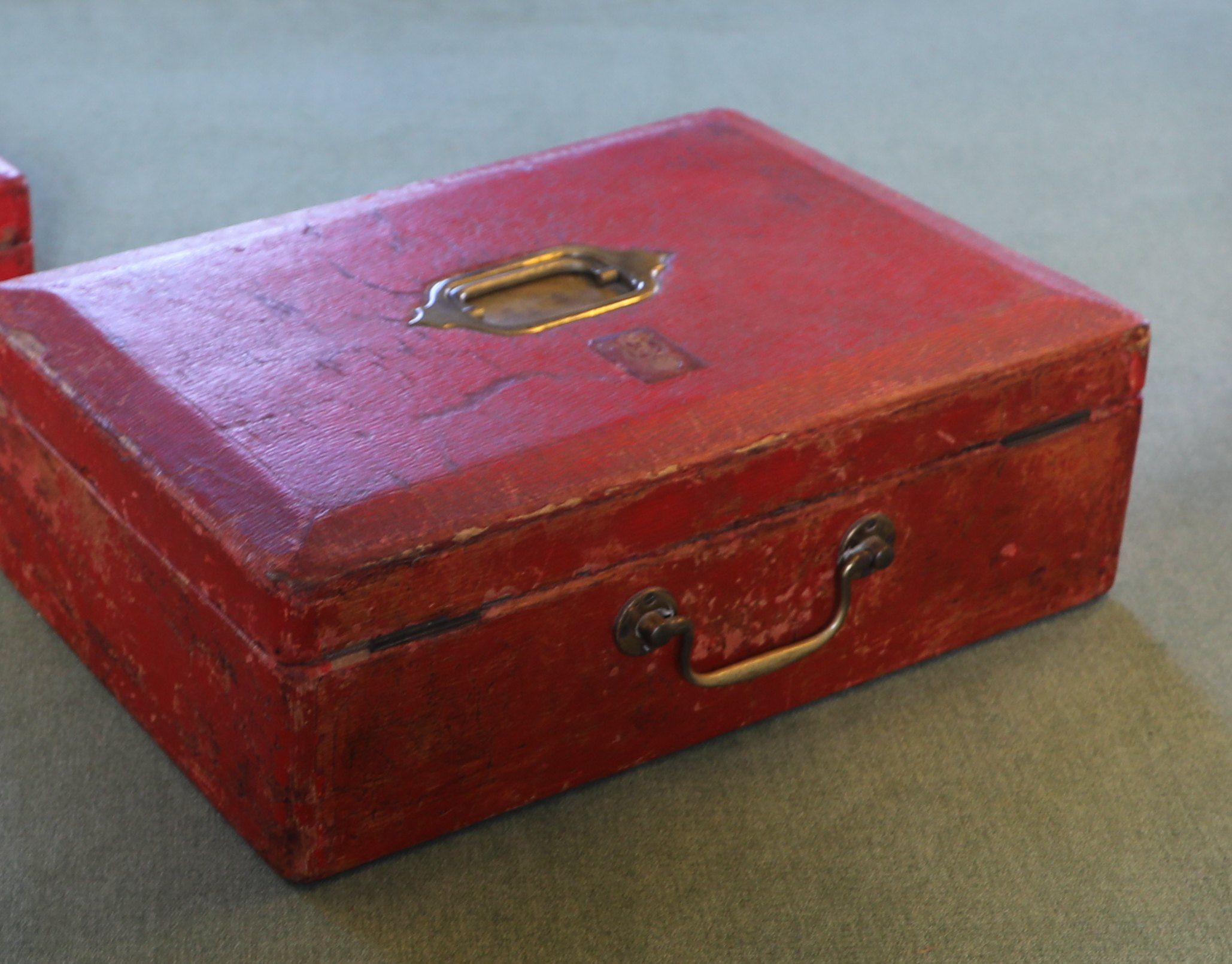 A worn red ministerial box, the kind chancellors carry on Budget day